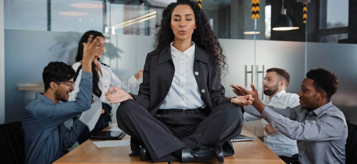 calm-businesswoman-professional-taking-break-meditating-sitting-table-office-meeting-ignoring