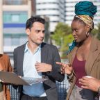 smart-dressed-business-people-discussing-matters-terrace-roof-men-women-different-nationalities-terrace-roof-using-laptop-work-modern-technology-team-concept