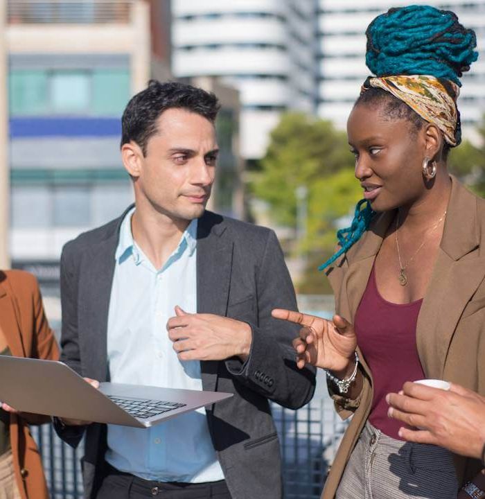 smart-dressed-business-people-discussing-matters-terrace-roof-men-women-different-nationalities-terrace-roof-using-laptop-work-modern-technology-team-concept