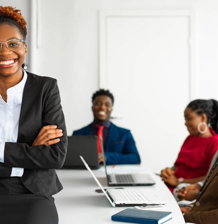 Businesswoman leading accredited corporate training session for B-BBEE skills development compliance in South Africa